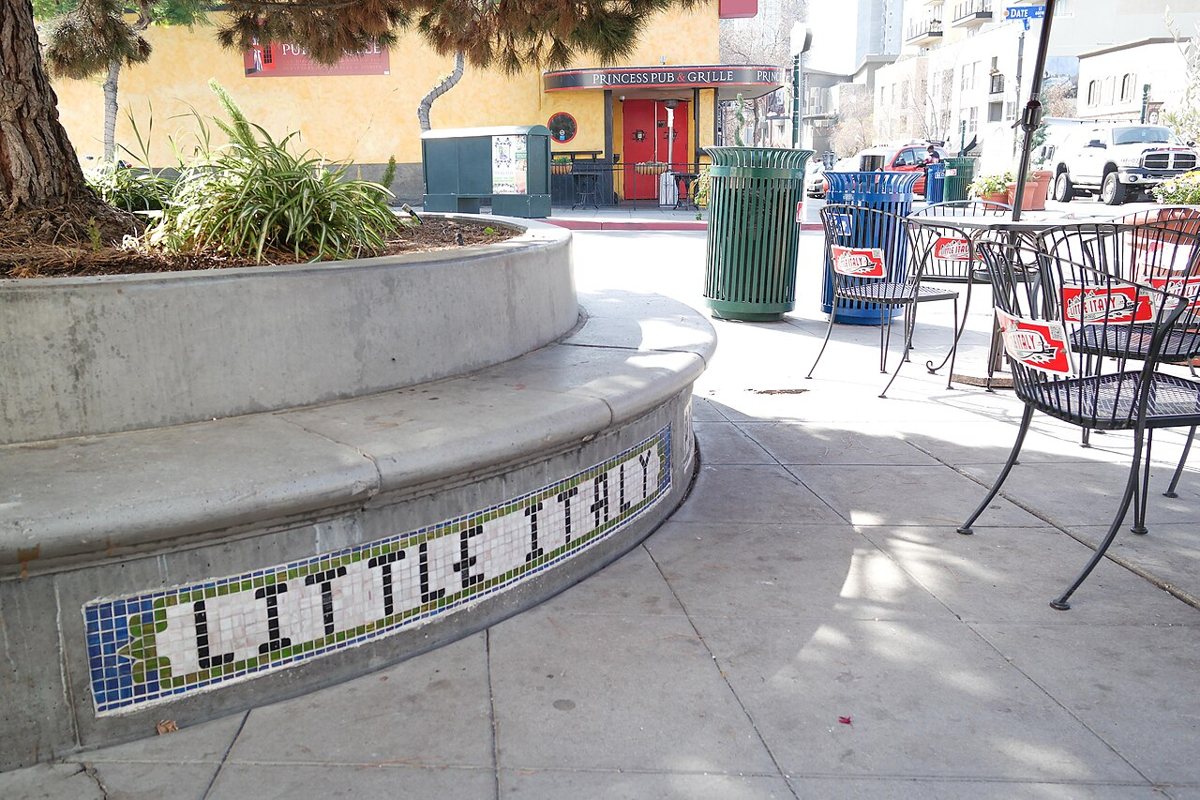Outdoor dining tables strung with lights along India Street in Little Italy San Diego